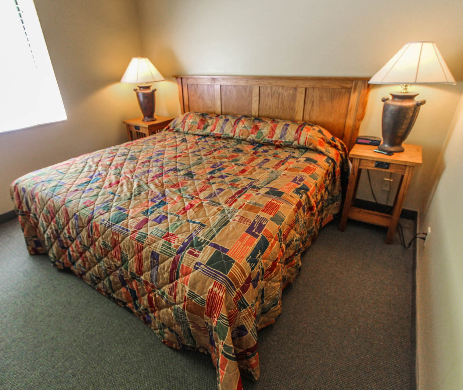 A cozy master bedroom at VRI's Powder Ridge Village in Eden, Utah.